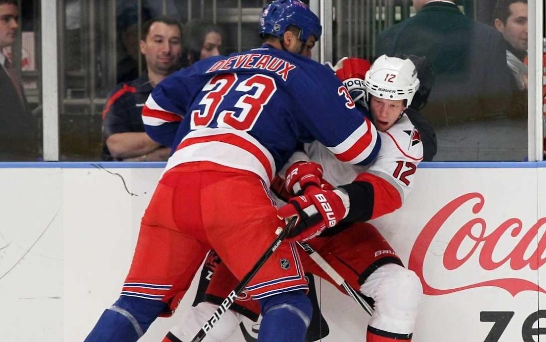 Andre Deveaux fighting in an NHL game